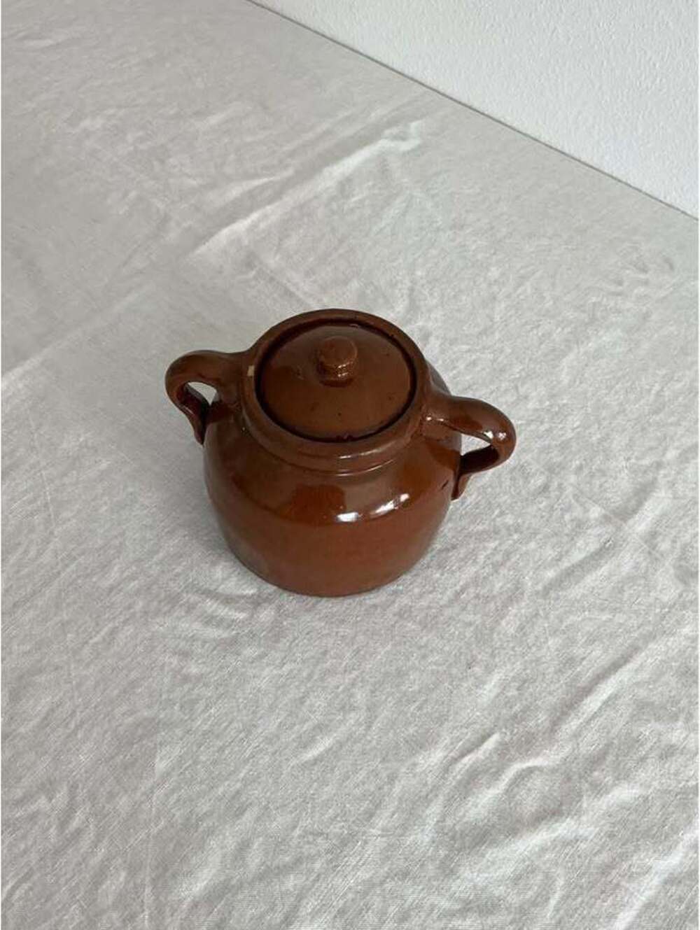 Vintage brown ceramic jar with lid